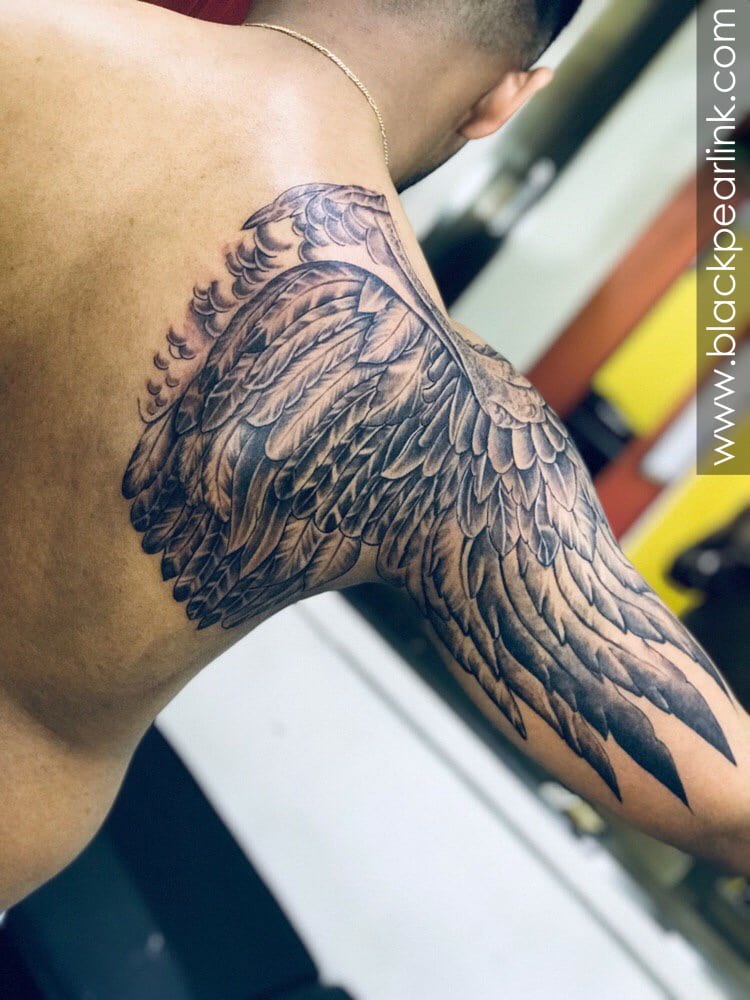 tribal eagle wing tattoos