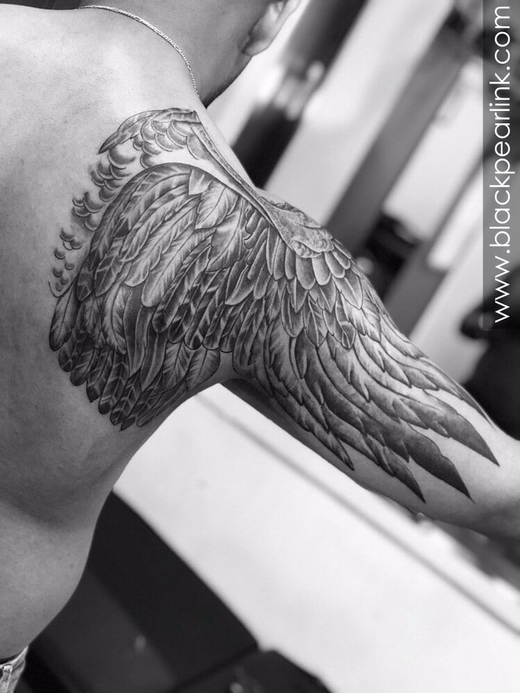 angel wing tattoos on upper arm