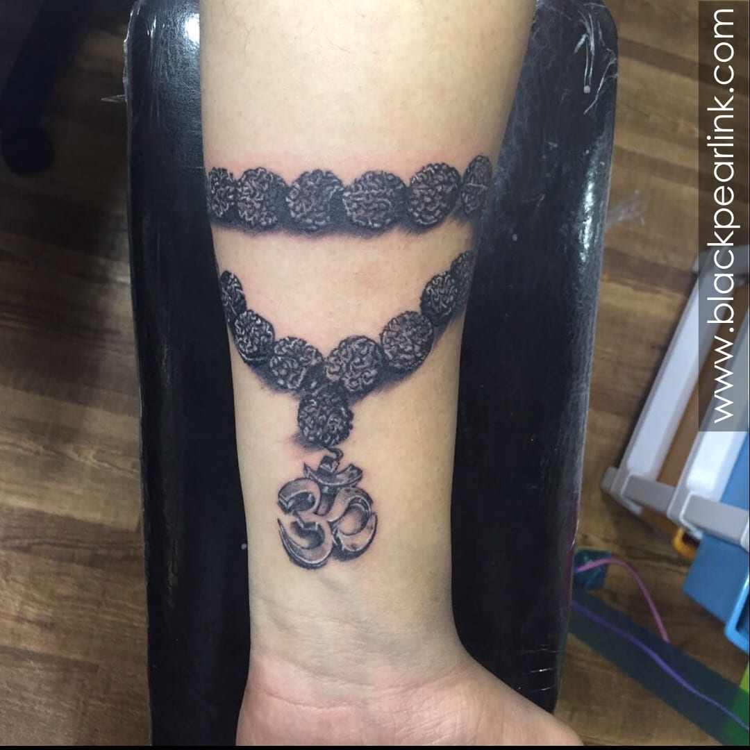 Om Tattoo with Rudraksha | Vimoksha Tattoos | Om tattoo, Om tattoo design,  Tattoo work
